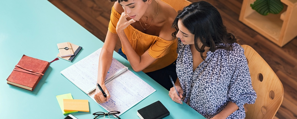 Two women studying