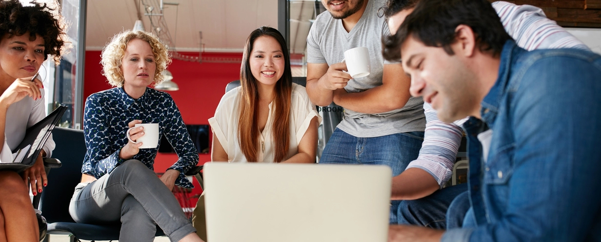 Group of people sitting in a small circle talking