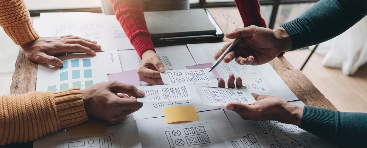 3 designers working on a prototype at a conference table