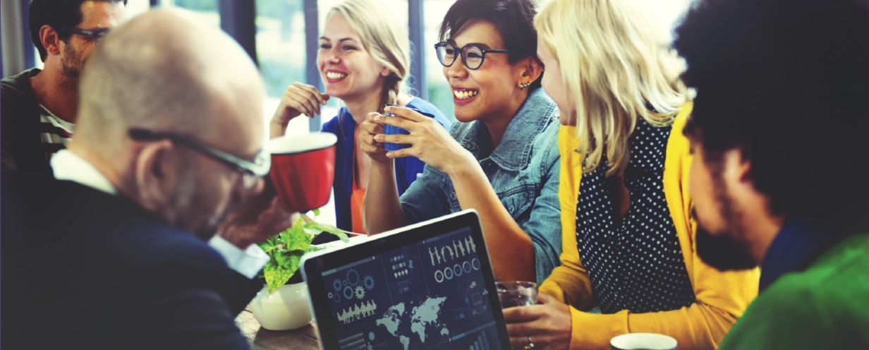 Photo of a group of business professionals sitting around a table