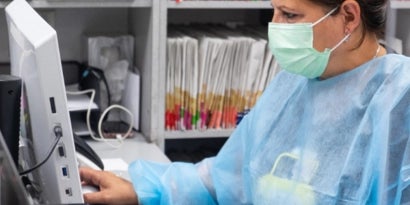 Woman in pharmaceuticals biotech working in a lab