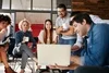 Group of people sitting in a small circle talking