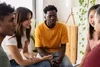 Group of people sitting in a small circle talking