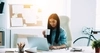 Woman working on her laptop in an office