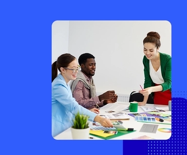 Team sitting at conference table in office